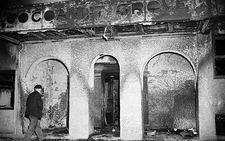 A man heads toward the three archways at the front entrance of the burned Cocoanut Grove nightclub in the Back Bay section of Boston on Nov. 29, 1942.