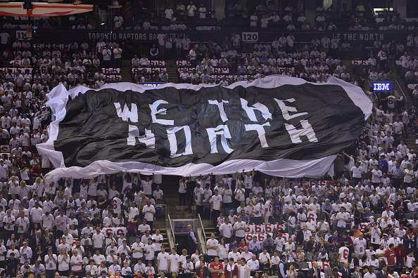 An overall view of the Air Canada Centre while the fans pass around the "WE ARE THE NORTH" flag during Game One of the Eastern Conference Playoffs Washington Wizards against the Toronto Raptors on April 18, 2015 in Toronto, Canada.  (Photo by David Dow/NBAE via Getty Images).