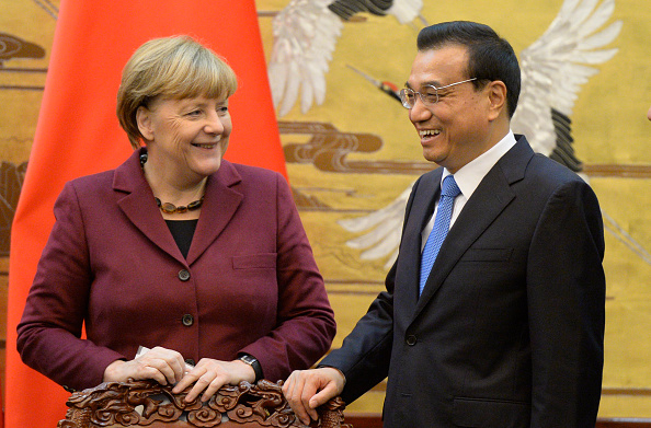 German Chancellor Angela Merkel (L), and Chinese Premier Li Keqiang smile affter a signing ceremony at the Great Hall of the People on October 29, 2015 in Beijing, China.  (Photo by Muneyoshi Someya-Pool/Getty Images).