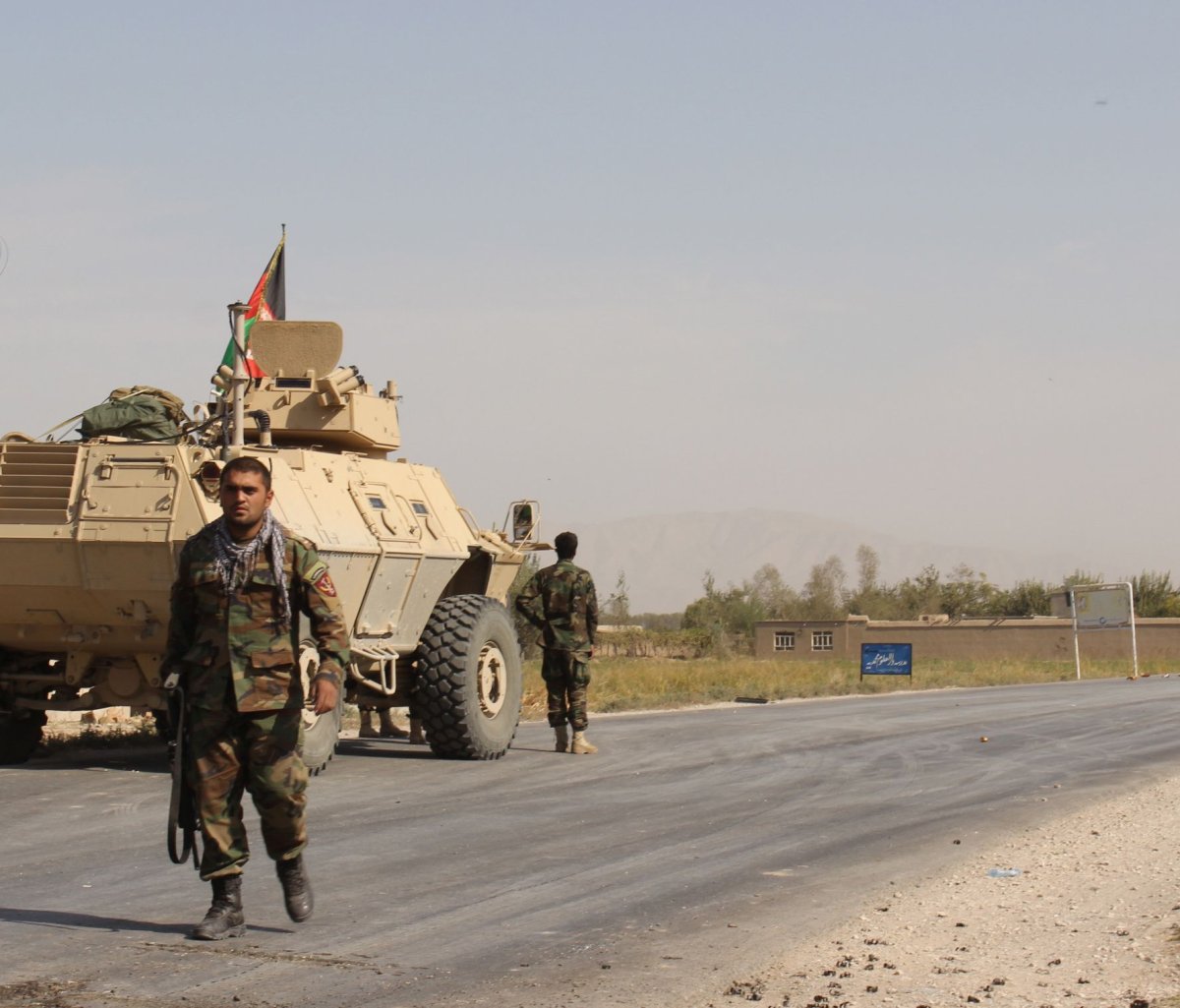 Afghan security forces take their position during  a clash by Taliban fighters in the highway between Baghlan to Kunduz city, north of Kabul, Afghanistan, on Friday, October 2. 