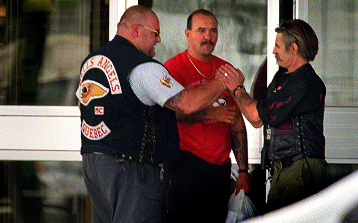 A member of the Hells Angels motorcycle gang Quebec chapter (left)  is greeted outside a hotel by a member of the Los Bravos in Winnipeg Friday July 21, 2000. 