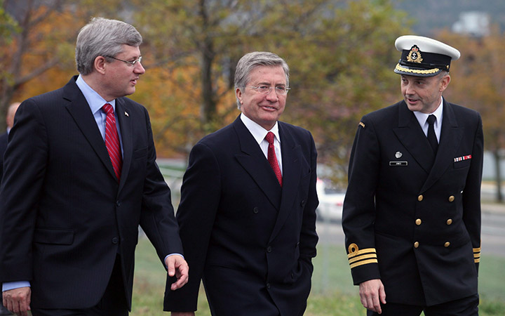 Prime Minister Stephen Harper, Premier Danny Williams, and Commander Lawrence Jones (left to right) walk to a ceremony at Canadian Forces Station in St.John's on Oct.21, 2010.