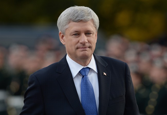 Prime Minister Stephen Harper arrives at a ceremony marking the one-year anniversary of the attack on Parliament hill Thursday Oct. 22, 2015 at the National War Memorial in Ottawa.