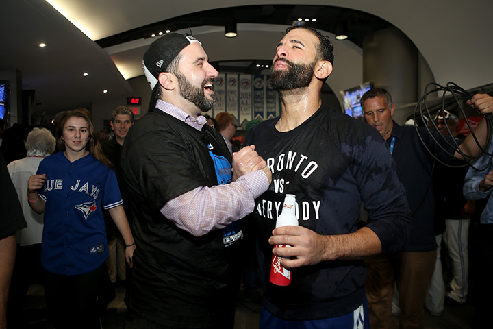 General Manager Alex Anthopoulos and Jose Bautista of the Toronto Blue Jays celebrate the 6-3 win against the Texas Rangers in Game 5 of the American League Division Series at Rogers Centre on October 14, 2015 in Toronto.  