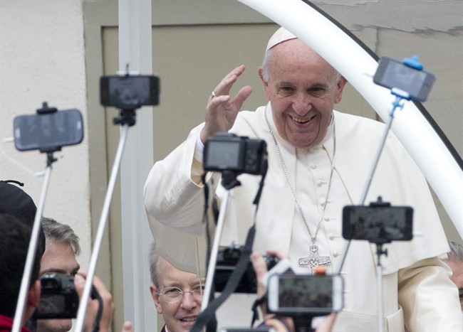 Pope Francis arrives for his weekly general audience in St. Peter's Square at the Vatican, Wednesday, Oct. 28, 2015.