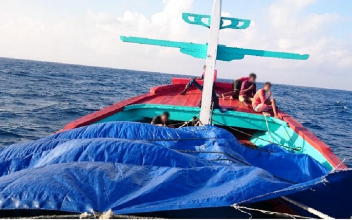 Amnesty International says this photo was taken by an asylum seeker on the two-deck boat which had departed from Indonesia. The photo was taken prior to
interception and transfer onto two smaller boats by Australian Border Force May 2015.