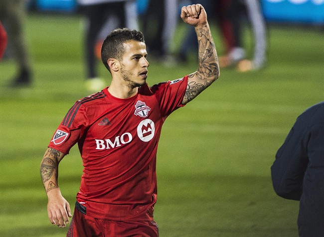 Toronto FC's Sebastian Giovinco celebrates a win against the New York Red Bulls during MLS action in Toronto on Wednesday October 14, 2015. Toronto FC has qualified for the Major League Soccer playoffs for the first time in the team's nine-year history after beating the visiting New York Red Bulls 2-1.