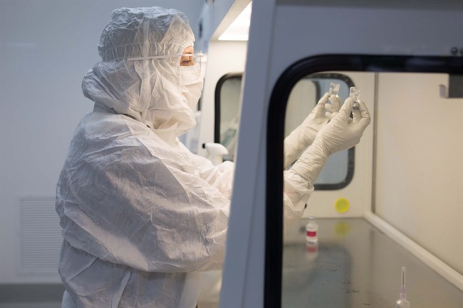 This photo courtesy of Joel Morillo of Passage Productions shows a technician inside Imprimis Pharmaceuticals in Irvine, Calif. Imprimis Pharmaceuticals Inc., which mixes approved drug ingredients to fill individual patient prescriptions, said Thursday, Oct. 22, 2015, it will supply capsules containing Daraprim’s active ingredients, pyrimethamine and leucovorin, for $99 for a 100-capsule bottle. 
