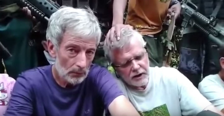Canadians Robert Hall and John Ridsdel are seen in a video released by militants, three weeks after they were kidnapped along with two others from a resort in the southern Philippines.