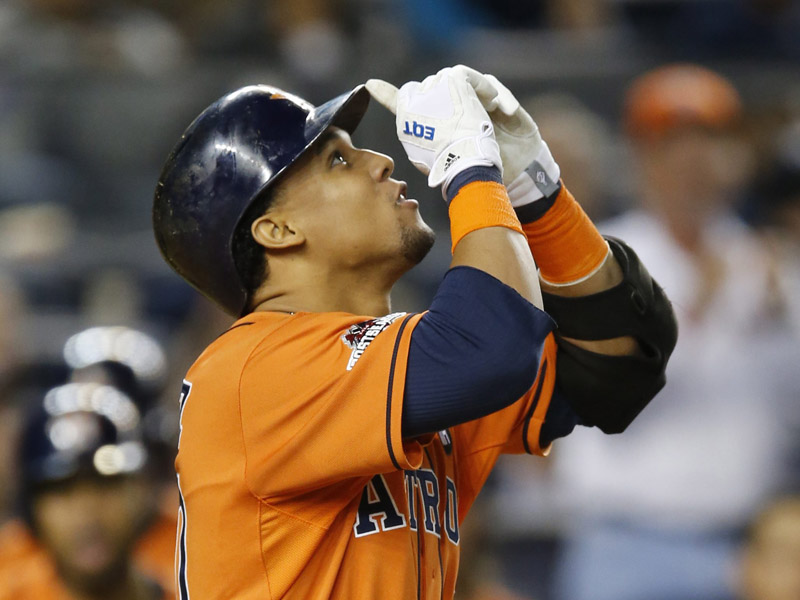 Houston Astros Carlos Gomez reacts after hitting a solo-home run during the fourth inning of the American League wild card baseball game against the New York Yankees.