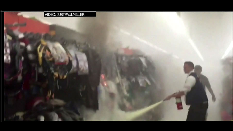 Caught on camera: Arsonist sets Halloween costumes in Walmart on fire - image