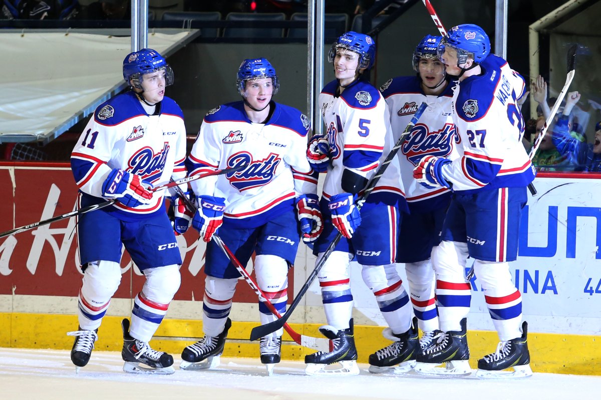 Taylor Cooper and the Regina Pats celebrate a goal.