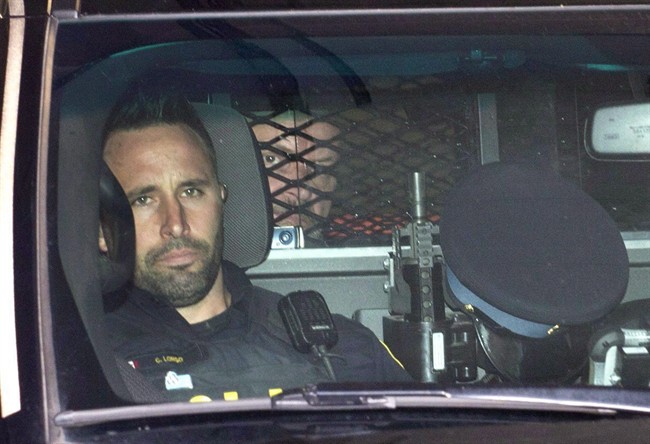 Basil Borutski leaves in a police vehicle after appearing at the courthouse in Pembroke, Ont. on Sept. 23, 2015.