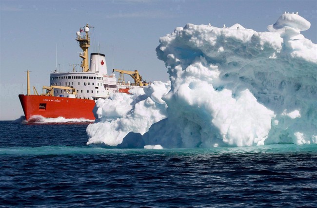 The Canadian Coast Guard icebreaker Louis S. St-Laurent sails past a iceberg in Lancaster Sound, Friday, July 11, 2008.