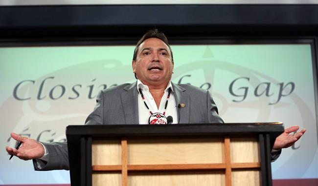 Assembly of First Nations National Chief Perry Bellegarde gestures during a news conference to outline the AFN's priorities for the 2015 federal election, in Ottawa, on September 2, 2015. Aboriginal activists who spent months mobilizing First Nations communities say Conservative Prime Minister Stephen Harper's attempt to disenfranchise aboriginal voters backfired and fuelled turnout so high that some reserves ran out of ballots.