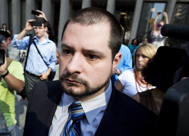 Toronto Police Const. James Forcillo leaves the court in Toronto, on Tuesday, August 20, 2013. 