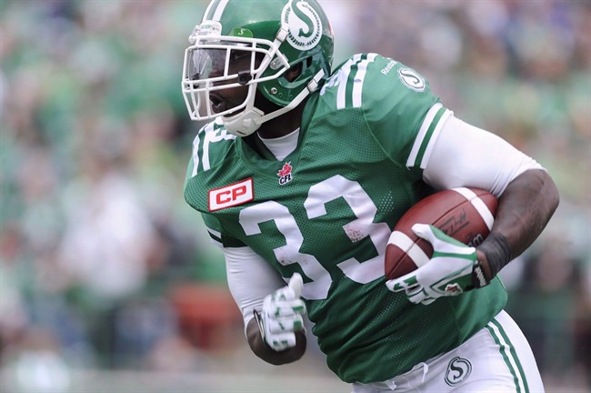 Saskatchewan Roughriders' Jerome Messam runs the ball against the Winnipeg Blue Bombers during second half CFL action in Regina on September 6, 2015. Two weeks of rest followed by a full week of practice with his new team, big running back Jerome Messam says he's ready for his debut as Calgary Stampeder on Saturday. The first team he faces wearing the red and white is the team that traded him - the Saskatchewan Roughriders.