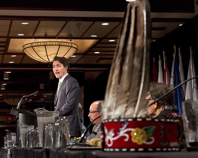 A First Nations headdress sits on a table as Federal Liberal Leader Justin Trudeau addresses the Assembly of First Nations congress in Montreal on July 7, 2015. 