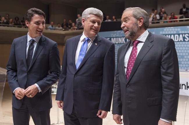 Liberal Leader Justin Trudeau, left to right, Conservative Leader Stephen Harper and NDP Leader Thomas Mulcair chat prior to the Munk Debate on foreign affairs, in Toronto, on September 28, 2015. 