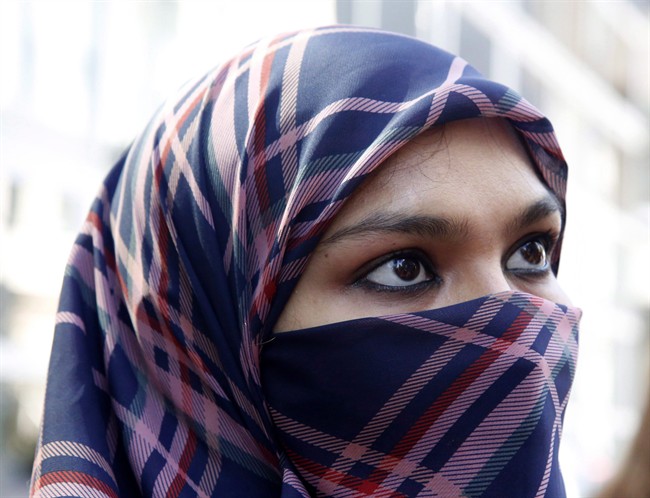 A woman wears a niqab.