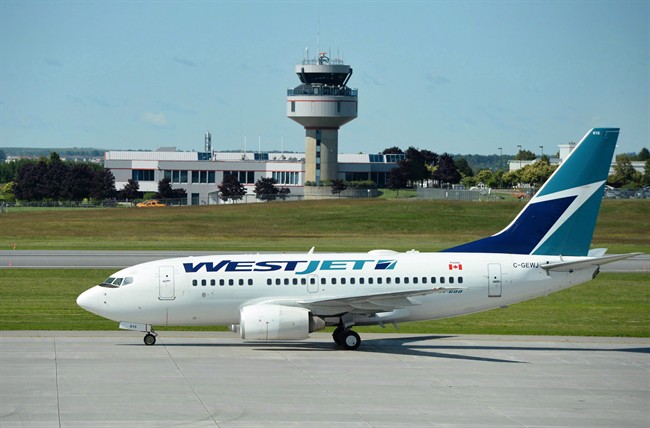 Calgary WestJet employee charged in travel credits fraud - image