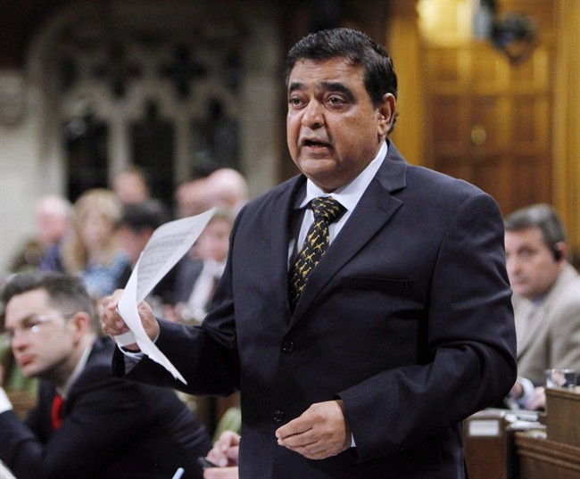 Conservative MP Deepak Obhrai stands in the House of Commons during question period in Ottawa, Friday, May 30, 2014. For a brief moment in history, Obhrai will be the man at the helm of the Conservative party caucus.THE CANADIAN PRESS/Fred Chartrand.