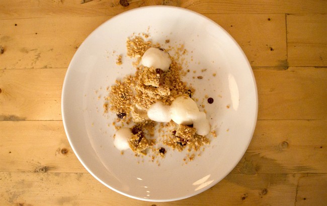 Farzam Fallah, pastry chef at Richmond Station restaurant in Toronto, makes a dessert called Cracker Jack, which features sticky toffee pudding, popcorn ice cream, salty peanuts and cream ale foam.