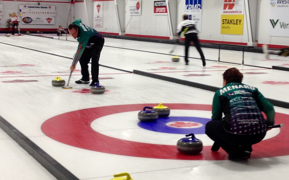 Dauphin's Lisa Menard and Ray Baker play at the Canad Inns Mixed Doubles Curling Classic in Portage la Prairie on October 20, 2015.