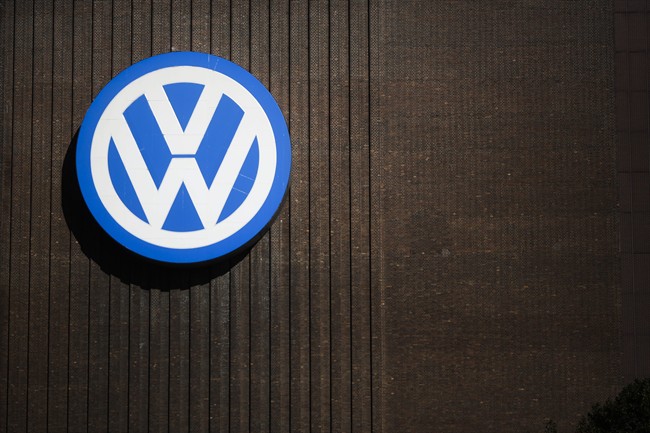 FILE - In this Sept. 29, 2015, file photo, a brand sign of the Volkswagen car company is seen at the car factory in Wolfsburg, Germany. More than a decade ago, the U.S. Environmental Protection Agency helped develop a technology that ultimately allowed an independent laboratory to catch Volkswagen’s elaborate cheating on car emissions tests. But EPA did not apply that technology on its own tests of diesel passenger cars and instead focused on trucks,thus missing its best chance to foil the German carmaker’s deception as early as 2007. 