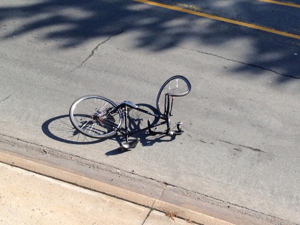 Bicycle appears mangled after being hit by propane truck.