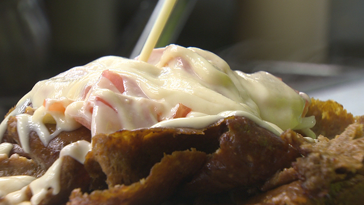 Donair sauce is squeezed onto the eponymous dish at King of Donair on Tuesday Oct. 20, 2015.