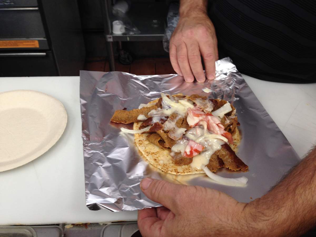 A fresh donair is wrapped up at the King of Donair restaurant.