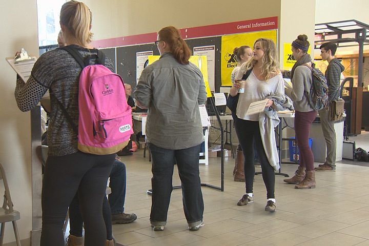Students lined up at the Elections Canada voting office