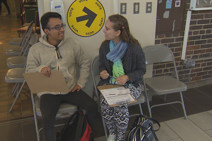 Genevieve Roots and Joshua Zarate register to vote