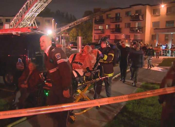 Firefighters escorted about 100 residents out of their homes after a blaze ignited, Tuesday, October 6, 2015.