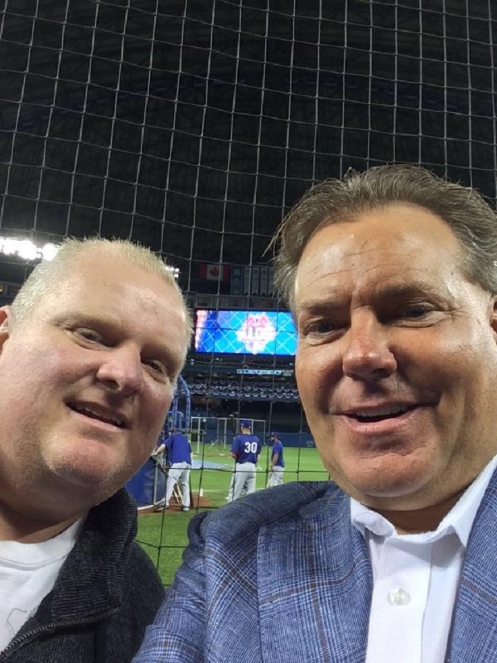Some Blue Jays fans are unhappy that Toronto city councillor Rob Ford  (left) is attending the critical Game 5 of the ALDS.