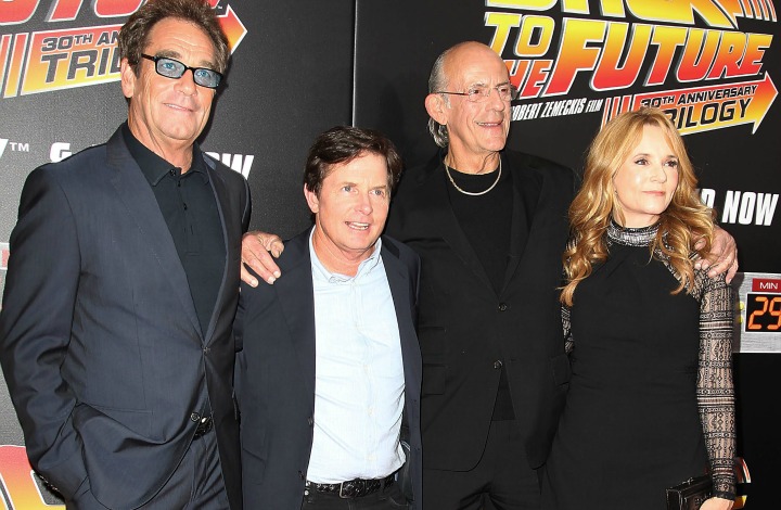 In this image released by Starpix, Huey Lewis, from left, Michael J. Fox, Christopher Lloyd and Lea Thompson arrive at the "Back To The Future" 30th Anniversary celebration, Wednesday, Oct. 21, 2015, in New York. 