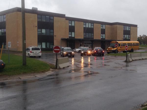 Heavy police presence outside Fredericton High School. The school and three others are on lockdown after a report of a teen with a gun in the area.