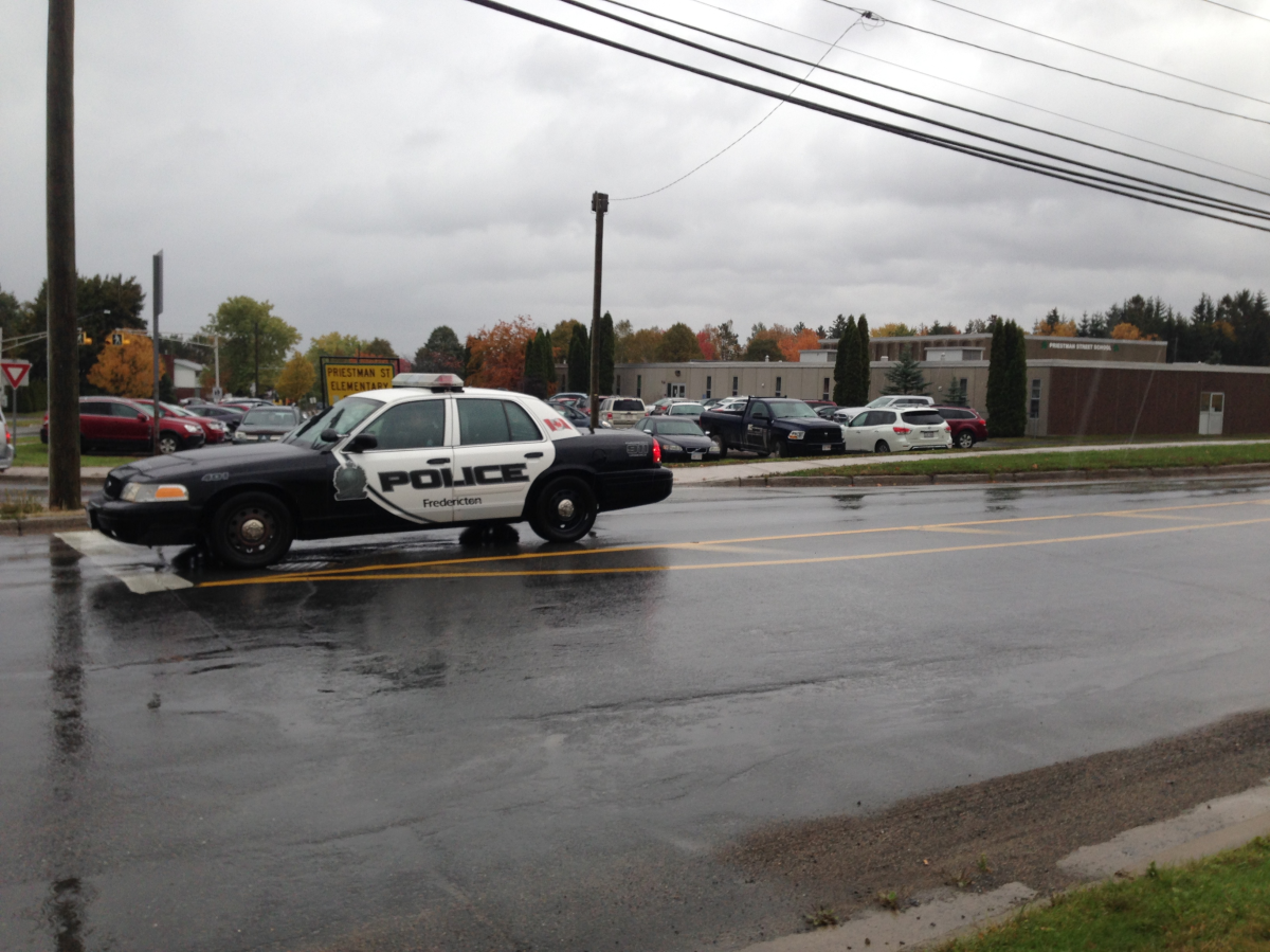 Several Fredericton schools on lockdown after a teen spotted with a possible firearm.