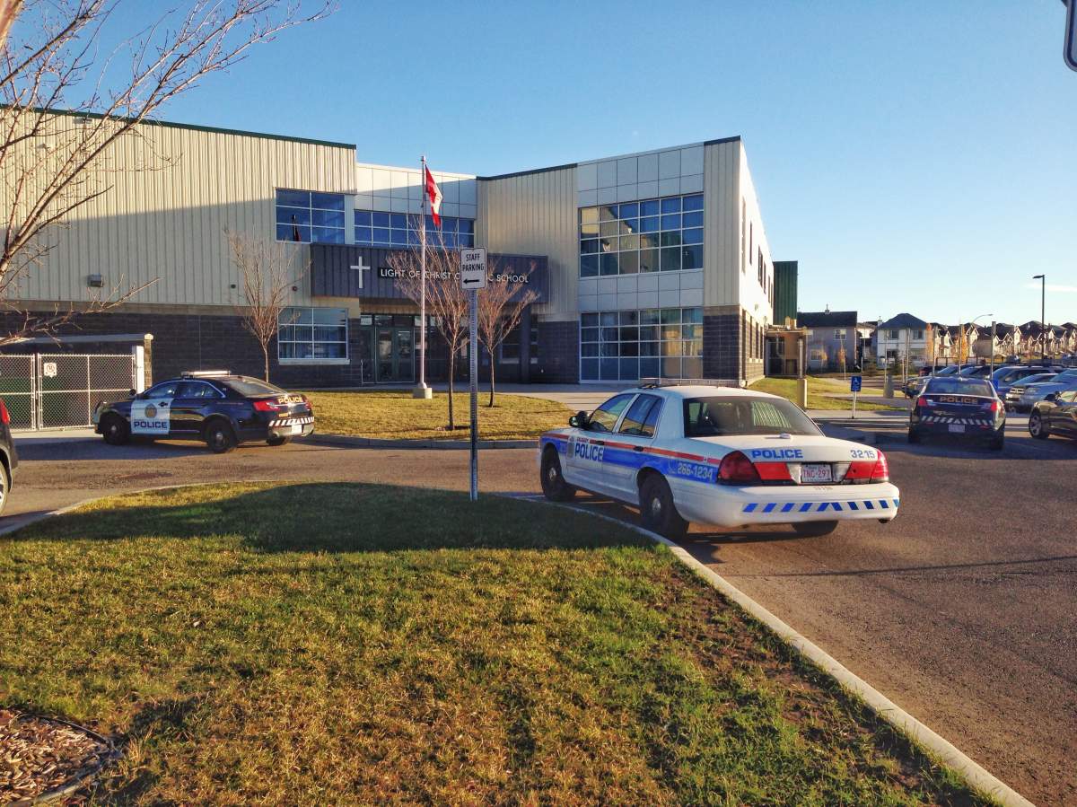 Police surround nearby Light of Christ elementary school Tuesday morning.