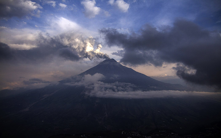 The Tungurahua volcano spewes ashes on February 3, 2014, as seen from Cotalo, south of Quito. 