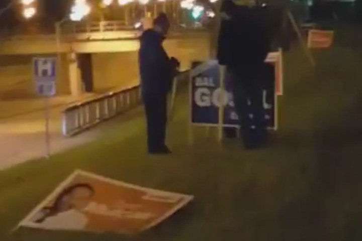 A Liberal campaign volunteer caught three men on video erecting signs for Conservative MP Bal Gosal and damaging signs for his NDP and Liberal rivals.