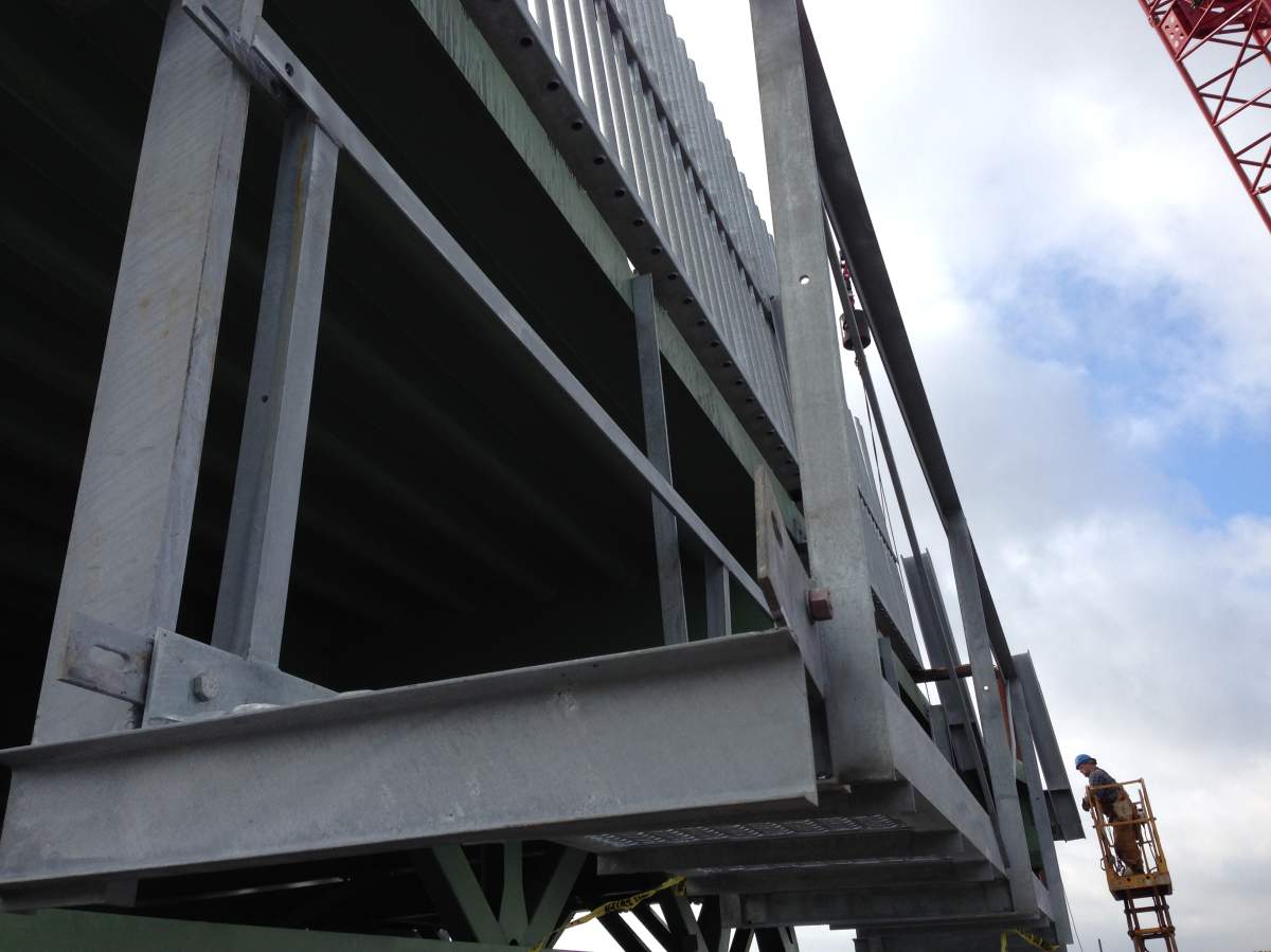 The deck segments will come with railings and catwalks already installed.