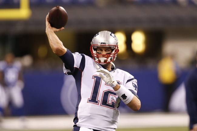New England Patriots quarterback Tom Brady (12) throws before an NFL football game against the Indianapolis Colts in Indianapolis, Sunday, Oct. 18, 2015. 