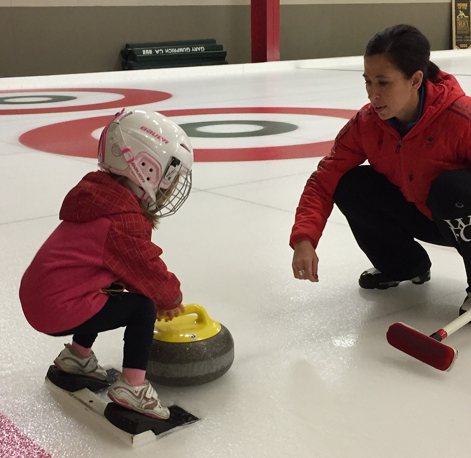 Jill Officer teaching her daughter Camryn out on the ice. 