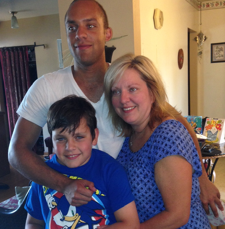 Joel Senick with his little brother and mom.