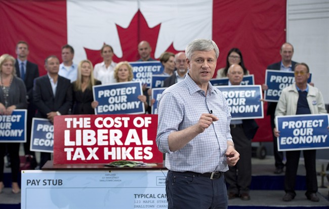 Conservative Leader Stephen Harper attends a campaign event at William F. White International in Etobicoke, Ont., Tuesday, Oct. 13, 2015. 