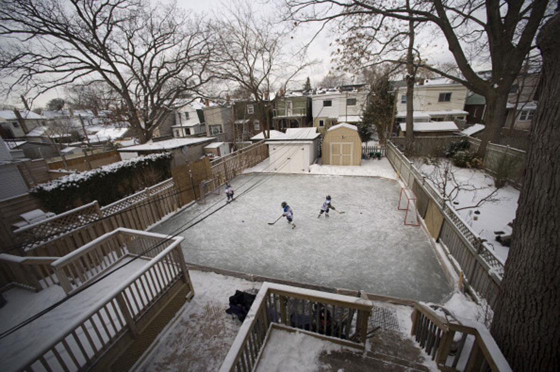 Kids playing on backyard hockey rink in Toronto. The average price of admission: $1.05 million.