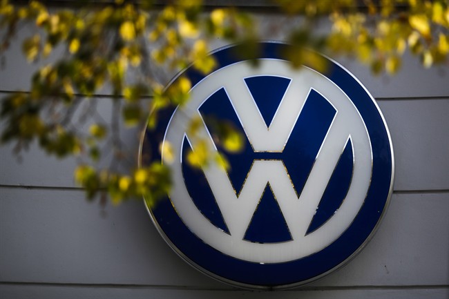 In this Oct. 5, 2015 file photo the VW sign of Germany's car company Volkswagen is displayed at the building of a company's retailer in, Berlin, Germany.  (AP Photo/Markus Schreiber, file).