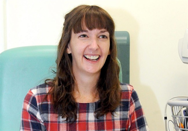 FILE - In this Saturday, Jan. 1, 2015 file photo, Pauline Cafferkey, a nurse who contracted Ebola while working in Sierra Leone, smiles in the Royal Free Hospital in London.